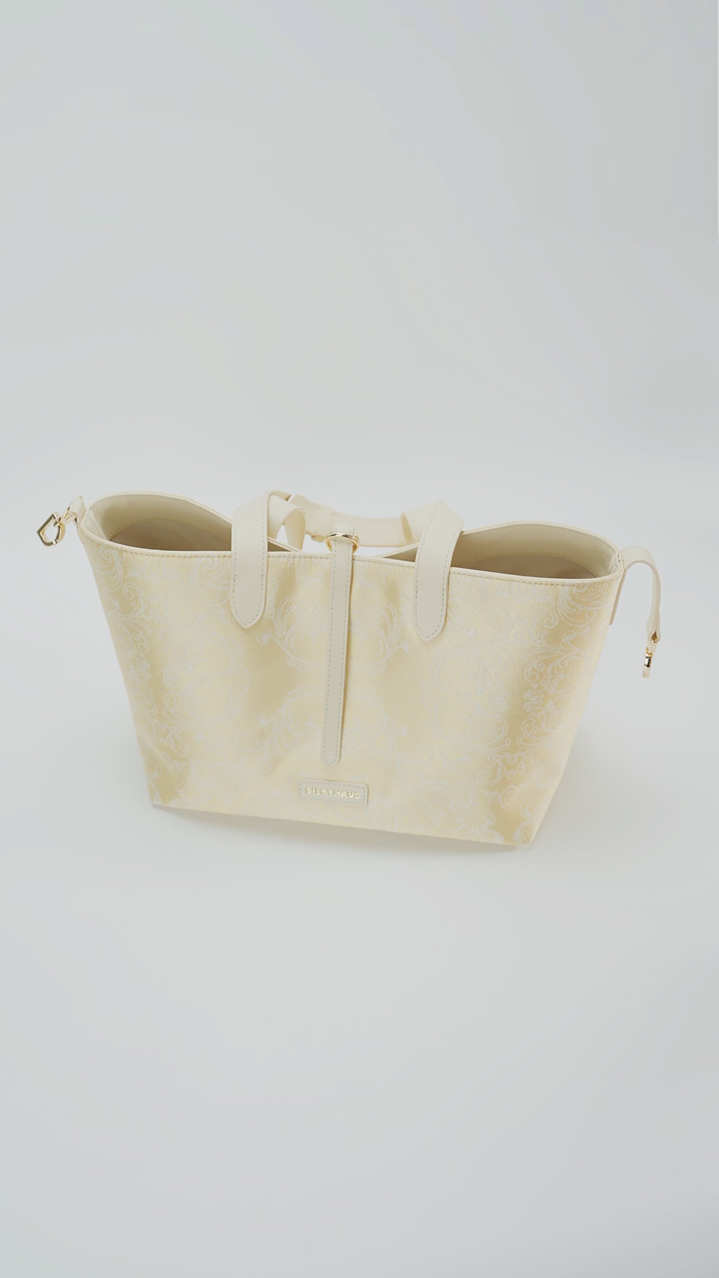 Interior capacity guide for Silkyhaus gold brocade tote bag, showing spacious internal structure and daily storage space