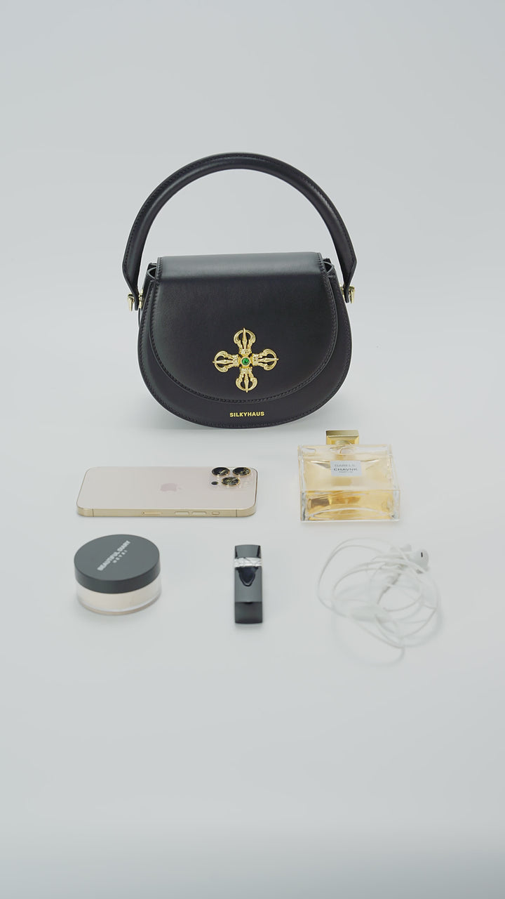 Interior capacity guide for Silkyhaus black leather crown top-handle bag, showing internal compartment layout and storage capacity