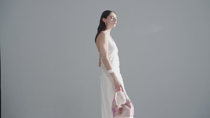 Promotional video of model showcasing Silkyhaus premium handbag collection