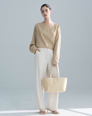 Gold Brocade Tote Bag shown in a front view on a model, luxury brocade tote bag by Silkyhaus