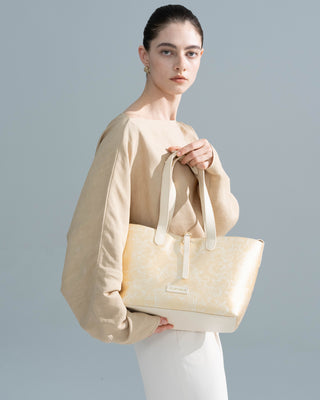 Gold Brocade Tote Bag shown in a front view on a model, luxury brocade tote bag by Silkyhaus