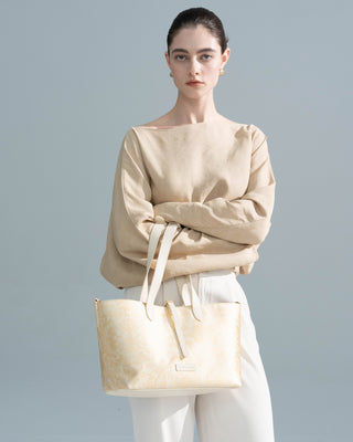 Gold Brocade Tote Bag held by a model, luxury brocade tote bag by Silkyhaus