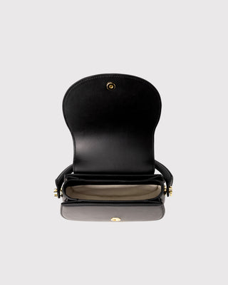 Top view of black embroidered leather handbag showing opening