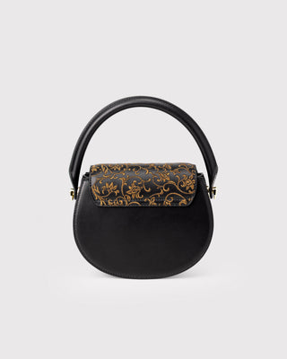 Back view of black scroll pattern embroidered top handle bag